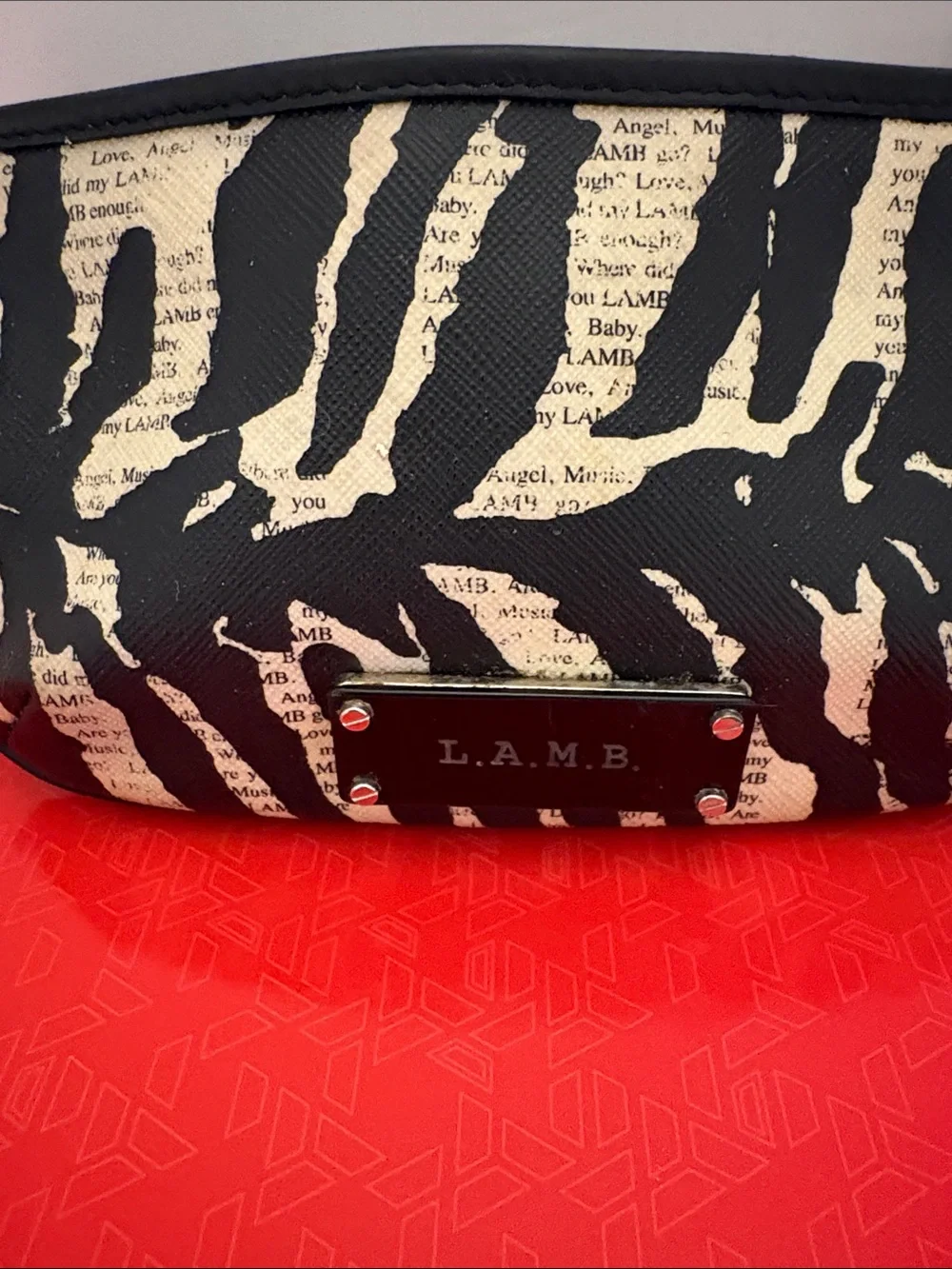 L.A.M.B. Black and Cream Zebra-Print Clutch with Logo Plate